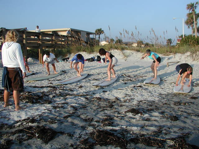 Cowgirls practice their pop-ups on the beach